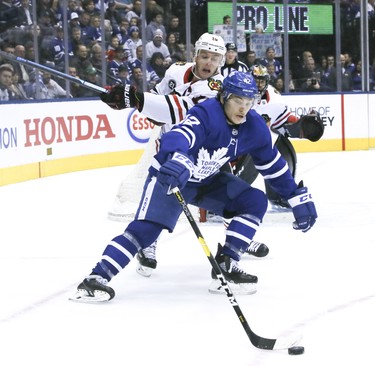 Trevor Moore for the Leafs reaches for the puck on Wednesday March 13, 2019. The Toronto Maple Leafs host the Chicago Blackhawks at the Scotiabank Arena in Toronto. Veronica Henri/Toronto Sun/Postmedia Network
