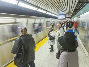 A TTC train leaving a subway station.