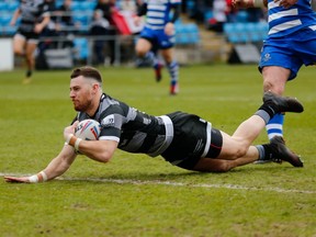 Toronto Wolfpack's Blake Wallace dives to score a try against Halifax RLFC during the Betfred Championship Round 8 match at Mbi Shay Stadium, Halifax, West Yorkshire, England, on  March 24, 2019. (THE CANADIAN PRESS/HO-Toronto Wolfpack-Stephen Gaunt)