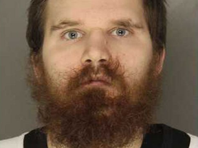 Cops say Clayton Lucas tried to strangle a driver who would not stop singing Christmas songs.