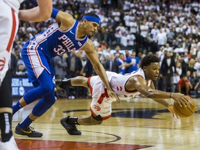Raptors' Kyle Lowry dives for the ball during Monday's game against the 76ers. (ERNEST DOROSZUK/Toronto Sun)