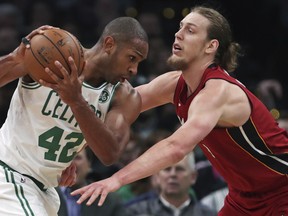 Miami Heat forward Kelly Olynyk defends against Boston Celtics' Al Horford during their game last week. (AP PHOTO)