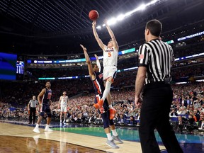 Virginia Cavaliers' Kyle Guy is fouled as he attempts a three-pointer against Auburn on Saturday. (GETTY IMAGES)