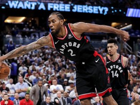 Kawhi Leonard #2 of the Toronto Raptors dives to save the ball from going out of bounds against the Orlando Magic during Game Four of the first round of the 2019 NBA Eastern Conference Playoffs at the Amway Center on April 21, 2019 in Orlando, Florida. The Raptors defeated the Magic 107 to 85. (Photo by Don Juan Moore/Getty Images)