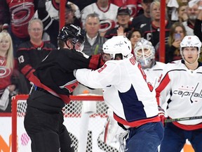 Alex Ovechkin #8 of the Washington Capitals knocks out Andrei Svechnikov #37 of the Carolina Hurricanes as they fight during the first period in Game Three of the Eastern Conference First Round during the 2019 NHL Stanley Cup Playoffs at PNC Arena on April 15, 2019 in Raleigh, North Carolina. (Photo by Grant Halverson/Getty Images)