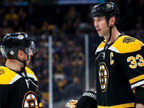 Boston Bruins' Brad Marchand (left) talks to Zdeno Chara during Thursday's Game 1 loss to Toronto. (GETTY IMAGES)