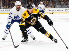 Boston Bruins ' Charlie Coyle is trailed by Leafs' Nazem Kadri during Game 1 on Thursday. (GETTY IMAGES)