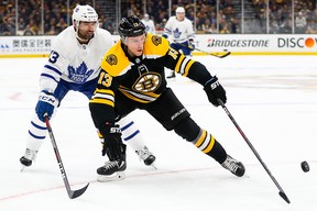 Boston Bruins ' Charlie Coyle is trailed by Leafs' Nazem Kadri during Game 1 on Thursday. (GETTY IMAGES)