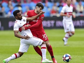 Toronto FC midfielder Alejandro Pozuelo was on the receiving end of a lot of physical play against the Chicago Fire  last week, especially from midfielder Mo Adams (left). (THE CANADIAN PRESS)