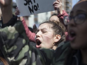 Students from a Toronto high school stage a walkout on Thursday, April 4, 2019 to protest the Ontario government's changes to the education system. (The Canadian Press)