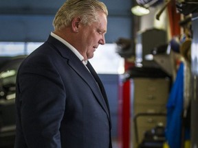 Ontario Premier Doug Ford heads outside after addressing media at the Thorncrest Ford dealership, near The Queensway and Hwy. 427 on April 1, 2019. (Ernest Doroszuk, Toronto Sun)