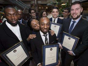 Yorkdale  security staff (from left) Shane Palmer, Nigel Penny, Marc Rotondo, and Luca Aiello, were recognized by Toronto Police for their actions during a shooting at the mall in August 2018. (Stan Behal, Toronto Sun)