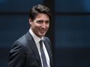 Prime Minister Justin Trudeau smiles as he speaks informally with members of caucus before delivering a speech on Parliament Hill in Ottawa, April 2, 2019. (The Canadian Press)