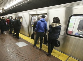 Passengers board a Toronto subway on April 9, 2019. (Veronica Henri, Toronto Sun)