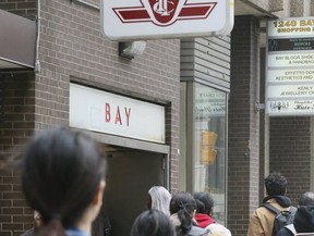 Pedestrians by the entrance of Toronto’s Bay subway station on April 9, 2019 (Veronica Henri, Toronto Sun)