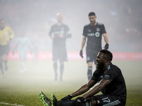 Toronto FC forward Jozy Altidore recovers on the ground after being tackled during last week's game against Minnesota. (THE CANADIAN PRESS)