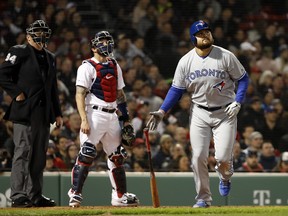 Toronto Blue Jays' Rowdy Tellez watches his two-run home run next to Boston Red Sox catcher Blake Swihart and umpire Lance Barrett during the third inning of a baseball game Thursday, April 11, 2019, at Fenway Park in Boston. (AP Photo/Winslow Townson)