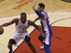 Toronto Raptors' Kawhi Leonard dribbles in the key looking to score during Saturday's win over the 76ers. (JACK BOLAND/Toronto Sun)