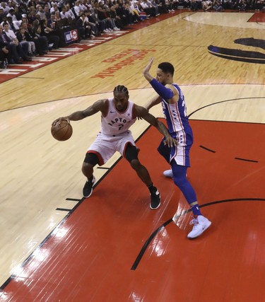 Toronto Raptors' Kawhi Leonard dribbles in the key looking to score during Saturday's win over the 76ers. (JACK BOLAND/Toronto Sun)