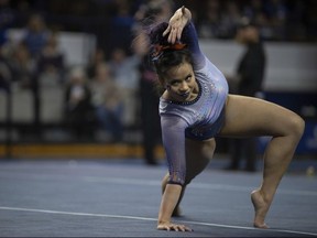 In this Feb. 1, 2019, file photo, Auburn's Samantha Cerio performs a floor routine during an NCAA gymnastics meet against Kentucky,in Lexington, Ky. Cerio is asking social media to stop sharing the video of her devastating leg injuries because “my pain is not your entertainment.” Auburn senior Samantha Cerio wrote on Twitter Wednesday, April 10, that seeing her “knees bent unnaturally in real life was horrible enough,” but she says continuing to see the video and photos because people feel entitled to repost them “is not okay.”