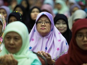 Muslim women pray after Brunei's Sultan Hassanal Bolkiah's speech during an event in Bandar Seri Begawan on April 3, 2019. (AFP/Getty Images)