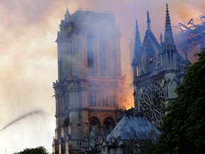 The landmark Notre-Dame Cathedral is engulfed by flames in central Paris on April 15, 2019.  (Photo by Geoffroy VAN DER HASSELT / AFP)
