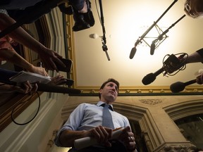 Prime Minister Justin Trudeau speaks with media before caucus on Parliament Hill in Ottawa, Wednesday, April 3, 2019. THE CANADIAN PRESS/Adrian Wyld