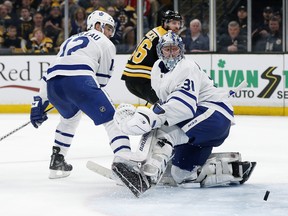 Maple Leafs goaltender Frederik Andersen watches as the puck ricochets off the post on a shot by Bruins’ David Krejci during the second period in Game 5 on Friday night in Boston. (AP PHOTO)