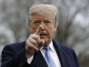 President Donald Trump speaks with reporters before boarding Marine One on the South Lawn of the White House, Friday, April 5, 2019, in Washington.