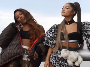Victoria Monet, left, and Ariana Grande in their video for "Monopoly." (YouTube screengrab)