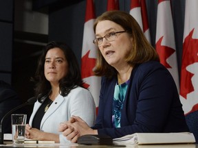 Then Health Minister Jane Philpott, right, speaks as Justice Minister Jody Wilson-Raybould looks on at a news conference in Ottawa on Thursday, April 14, 2016. (THE CANADIAN PRESS/Adrian Wyld)