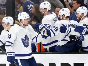 Leafs forward Auston Matthews celebrates with teammates after scoring a goal against the Bruins during the third period of Game 5 of the NHL's Eastern Conference first round playoff series at TD Garden in Boston on Friday, April 19, 2019.