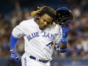 Toronto Blue Jays rookie Vladimir Guerrero Jr. reacts to a long flyout against the Oakland Athletics during the fourth inning of MLB baseball action in Toronto, Friday April 26, 2019. THE CANADIAN PRESS/Mark Blinch