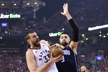 Raptors centre Marc Gasol battles Magic centre Nikola Vucevic for the ball during first half playoff action in Toronto on Tuesday
 THE CANADIAN PRESS/Frank Gunn