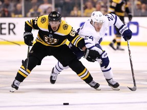 Bruins winger Brad Marchand (left) and Toronto's Kasperi Kapanen battle for the puck during the playoffs last year. Marchand is a thorn in the Maple Leafs' side almost every time the two teams play. (Maddie Meyer/Getty Images)