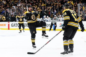 Bruins’ Marcus Johansson (left) celebrates with Charlie Coyle after scoring on a turnover by Leafs defenceman Jake Gardiner in Game 7 of their playoff series on Tuesday. GETTY IMAGES