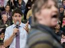 Prime Minister Justin Trudeau speaks with a protestor during a town hall meeting in Cambridge, Ont., on Tuesday April 16, 2019.