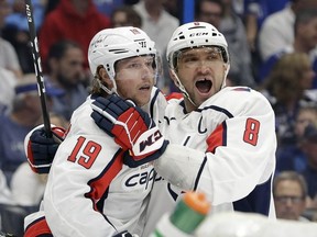 Washington Capitals center Nicklas Backstrom celebrates his goal against the Tampa Bay Lightning with left wing Alex Ovechkin during the first period of an NHL hockey game Saturday, March 30, 2019, in Tampa, Fla.
