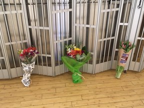 On Friday, April 12, 2019, a few bouquets of flowers were left out front of Fast Fresh Foods in Commerce Court, near where Rae Cara Carrington, 51, was stabbed to death Wednesday evening. (Joe Warmington/Toronto Sun/Postmedia Network)