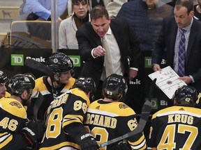 Bruins coach Bruce Cassidy talks to his players during Boston's open-round series against Toront0. The Leafs hold a 3-2 series lead. (Charles Krupa/The Associated Press)