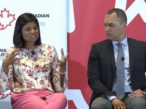 Saima Malik, left, and Peter Sloly take part in the Canadian Club Toronto's 'Being Brown Downtown' talk in Toronto on Tuesday, April 30