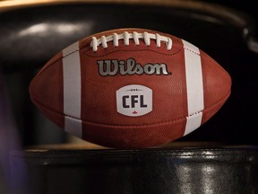 A football with the new CFL logo sits on a chair in Winnipeg, Friday, November 27, 2015. (THE CANADIAN PRESS/John Woods)