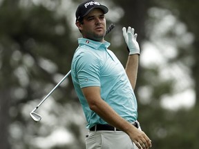 Corey Conners drops his club after his tee shot on the fourth hole during the second round of the Masters Friday, April 12, 2019, in Augusta, Ga. (AP Photo/Chris Carlson)