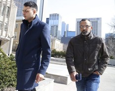 Galeeb Abau-Jabeen, left, enters court with his father after a smoke break on Thursday during his criminal negligence causing death and criminal negligence causing bodily harm trial in connection with a deadly 2016 crash on Bloor St. E. and Parliament.