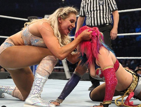 Charlotte Flair and Asuka in one of their epic slugfests. WWE