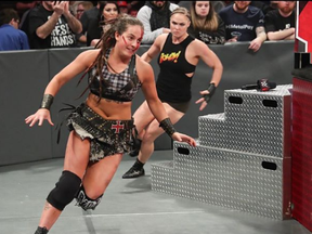 Ronda Rousey chases Sarah Logan in a 2019 match. WWE