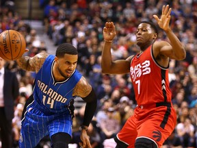 Magic point guard D.J. Augustin (left) will have his hands full trying to match the play of Raps’ Kyle Lowry. (DAVE ABEL/TORONTO SUN FILES)