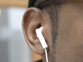A B.C. man whose iPhone battery was dead was found guilty of using it while driving because his earbuds were still in his ears.