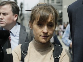 Actress Allison Mack leaves Brooklyn federal court Monday, April 8, 2019, in New York. (AP Photo/Mark Lennihan)