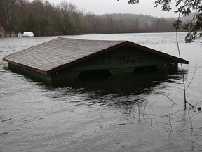 A boat house is covered by the flood on Lake McGregor in Val-des-Monts, Que.,  April 26, 2019.